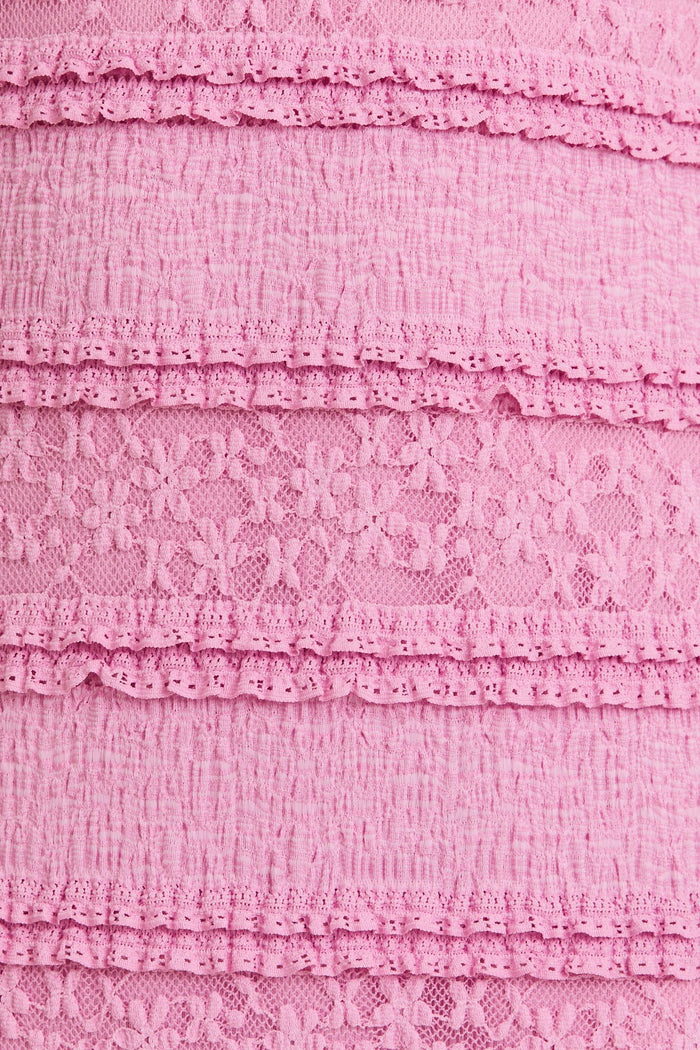 pink textured fabric with layered lace detailing