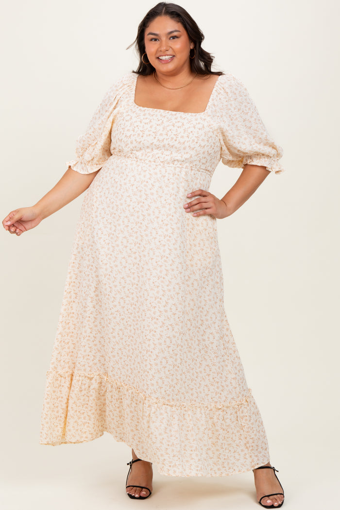 plus size woman wearing a light floral maxi dress with a square neckline and puff sleeves
