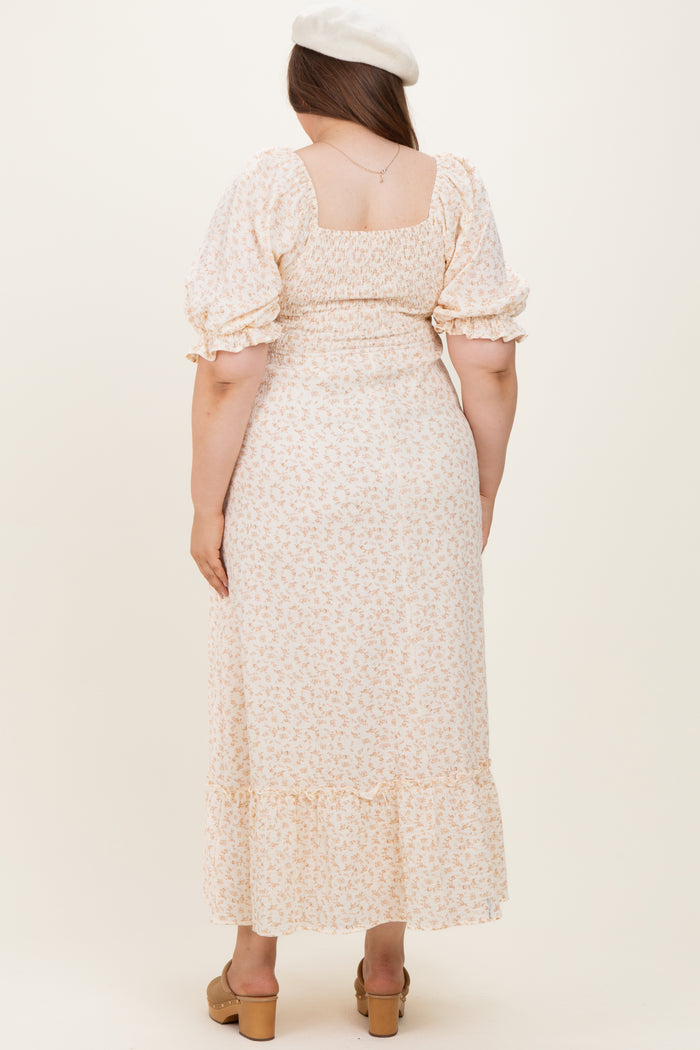 woman wearing a floral maternity plus dress with a square neckline and puff sleeves, showing a baby bump from the back