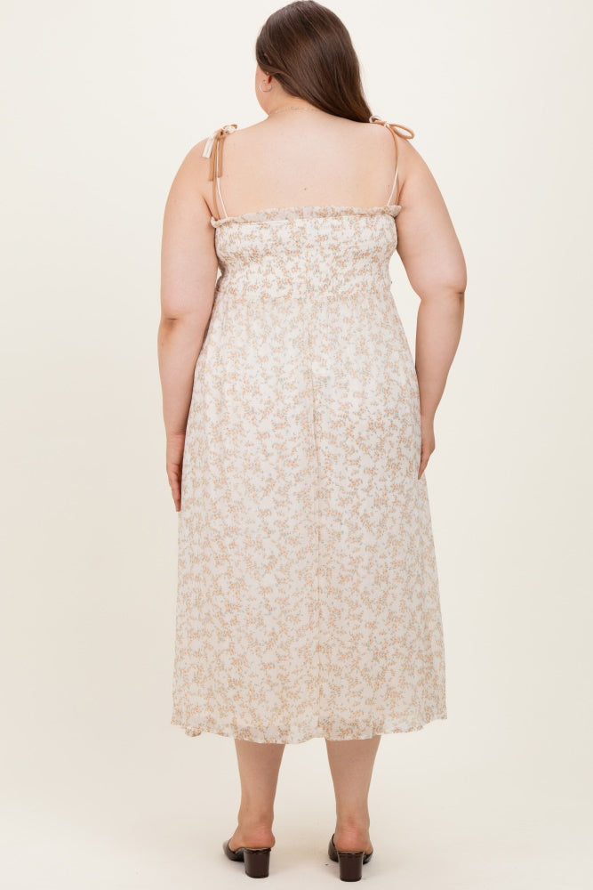 woman wearing a floral maternity plus sundress with adjustable straps, shown from the back