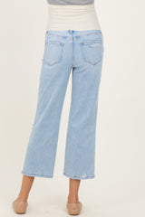 woman wearing light blue maternity wide-leg jeans, showing the back view with a relaxed fit