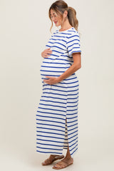 woman wearing a striped blue and white maternity dress with side slits and a visible baby bump