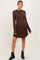 woman wearing a brown ribbed long sleeve maternity dress with a visible baby bump and ankle boots