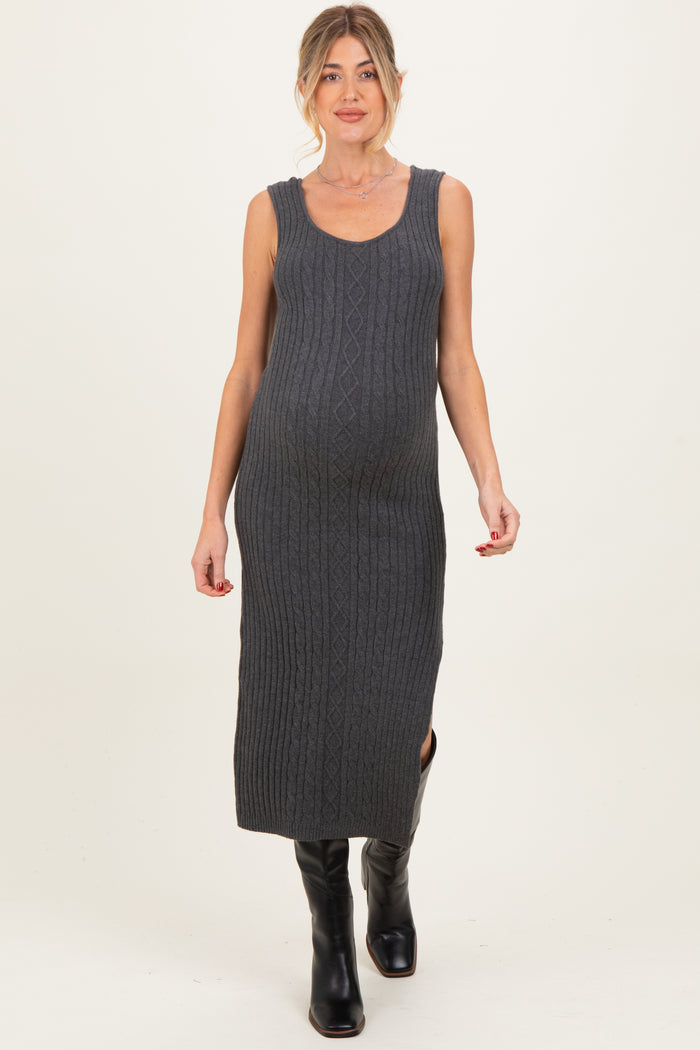 woman wearing a gray ribbed maternity dress with a fitted silhouette and side slit, highlighting her baby bump