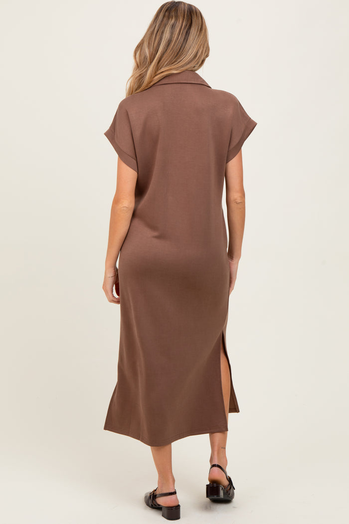 woman wearing a brown maternity dress with short sleeves and a side slit, view from the back