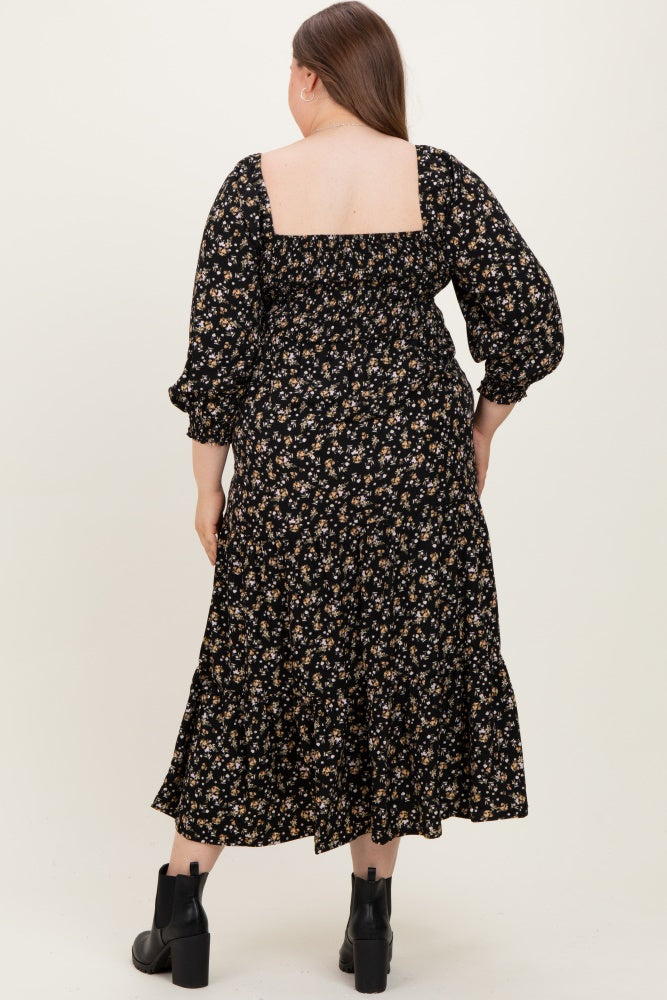 maternity plus size woman wearing a black floral maxi dress with puff sleeves and a square back design