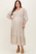 woman wearing a white floral print maternity plus dress with puff sleeves and a tiered skirt, showcasing her baby bump