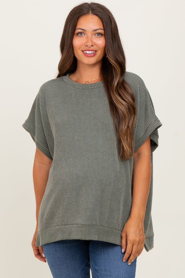 woman wearing an olive green ribbed maternity top, relaxed fit with short sleeves and a round neckline