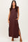 woman wearing a brown sleeveless maxi dress with side pockets and side slits