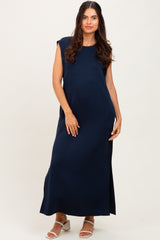 woman wearing a navy blue sleeveless maxi dress with side slits and a relaxed fit