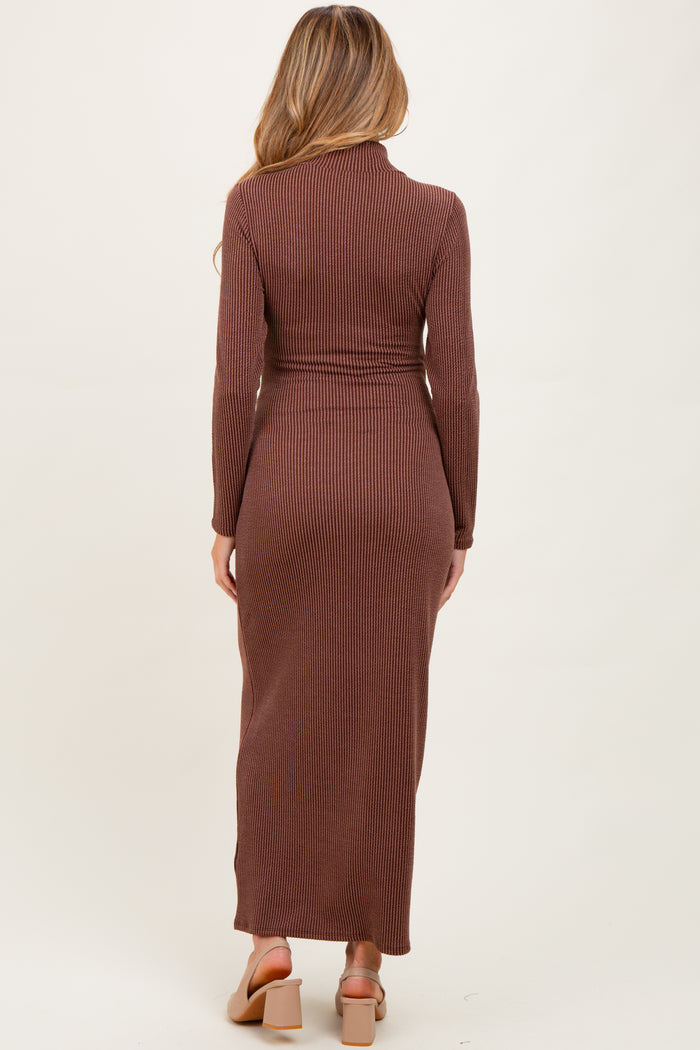 woman wearing a brown ribbed maternity maxi dress with long sleeves and a fitted silhouette, showing a baby bump from the back