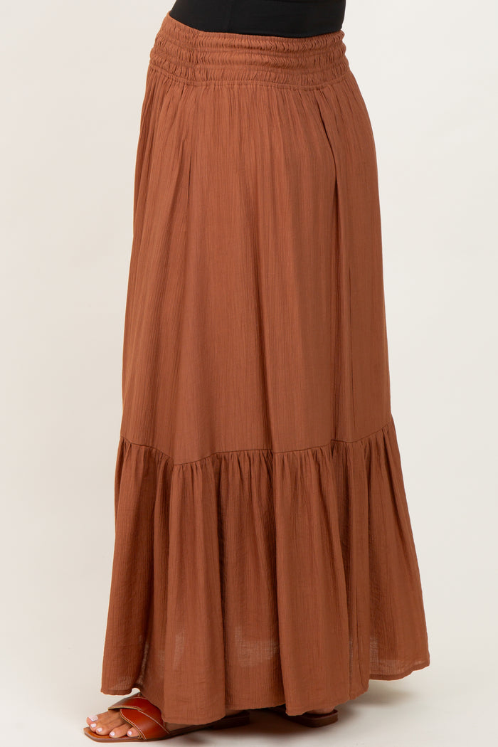maternity wear rust colored maxi skirt with a tiered hem and elastic waistband