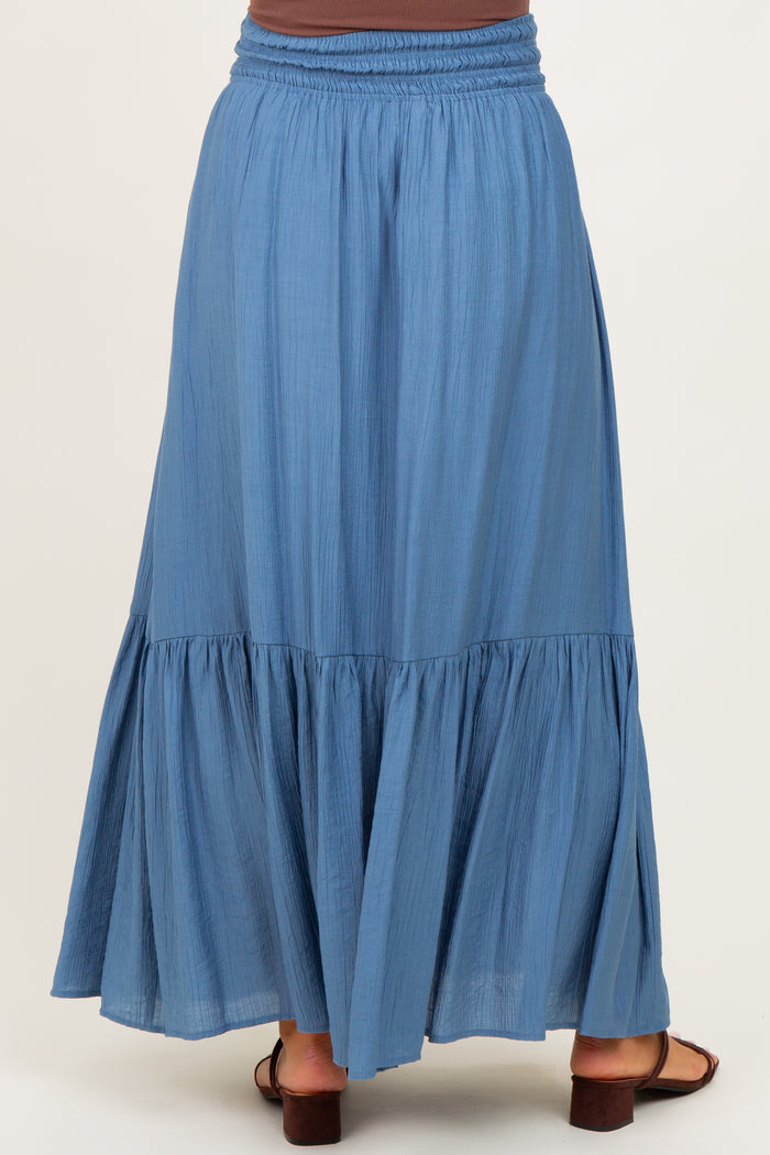 maternity wear long blue tiered maxi skirt with elastic waistband and flowy hem, shown from the back