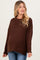 woman wearing a brown textured maternity sweater with a relaxed fit and visible baby bump