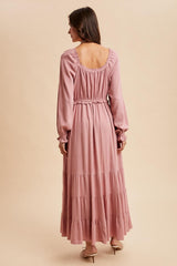 women's long sleeve dusty pink maxi dress with ruffled tiers and an elastic waist, shown from the back