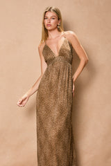 woman wearing a leopard print maxi dress with a deep v-neck and adjustable straps