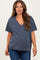 woman wearing a dark blue v-neck maternity top with short sleeves and a relaxed fit