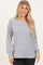 woman wearing a white and navy striped long sleeve v-neck top with relaxed fit and balloon sleeves