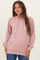 woman wearing a light pink ribbed maternity hoodie with a front pocket and drawstring hood