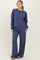 woman wearing a navy blue relaxed fit sweatshirt and matching wide leg pants