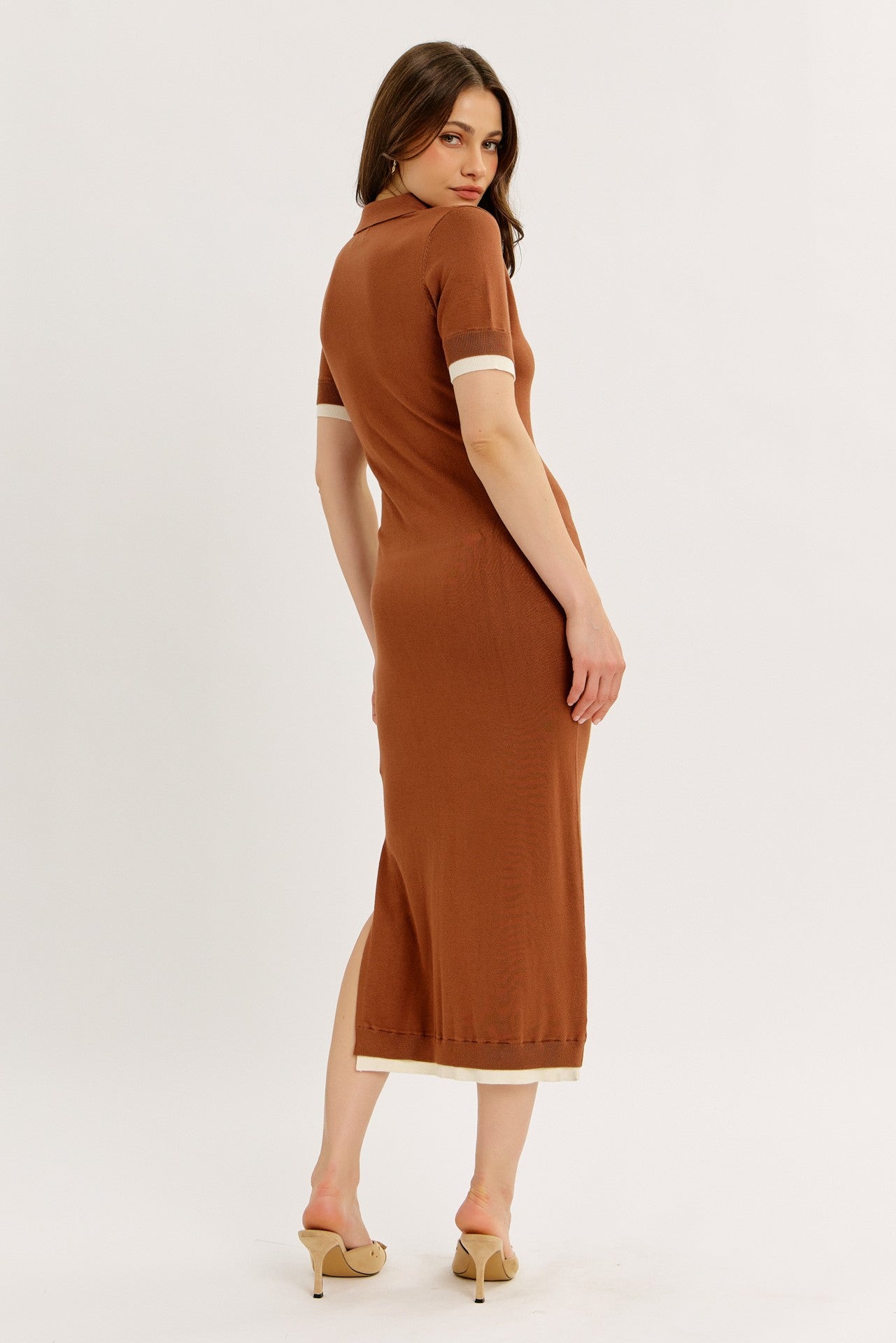 woman wearing a brown ribbed midi dress with short sleeves and contrast trim, viewed from the back