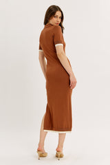 woman wearing a brown ribbed midi dress with short sleeves and contrast trim, viewed from the back