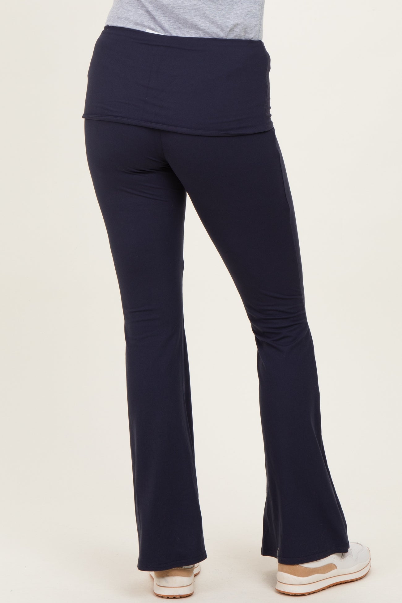 woman wearing navy blue flared lounge pants seen from the back