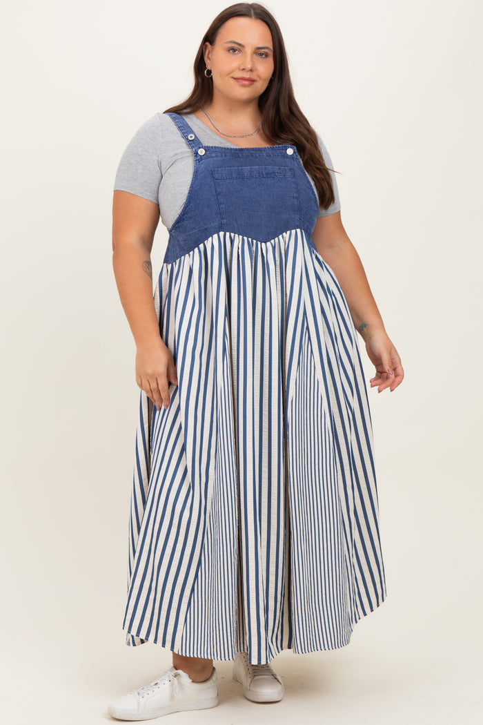 woman wearing a blue denim and striped long maxi dress with a fitted bodice and relaxed skirt