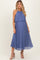 woman wearing a pleated blue maternity maxi dress with a halter neckline and flowy silhouette, showcasing her baby bump