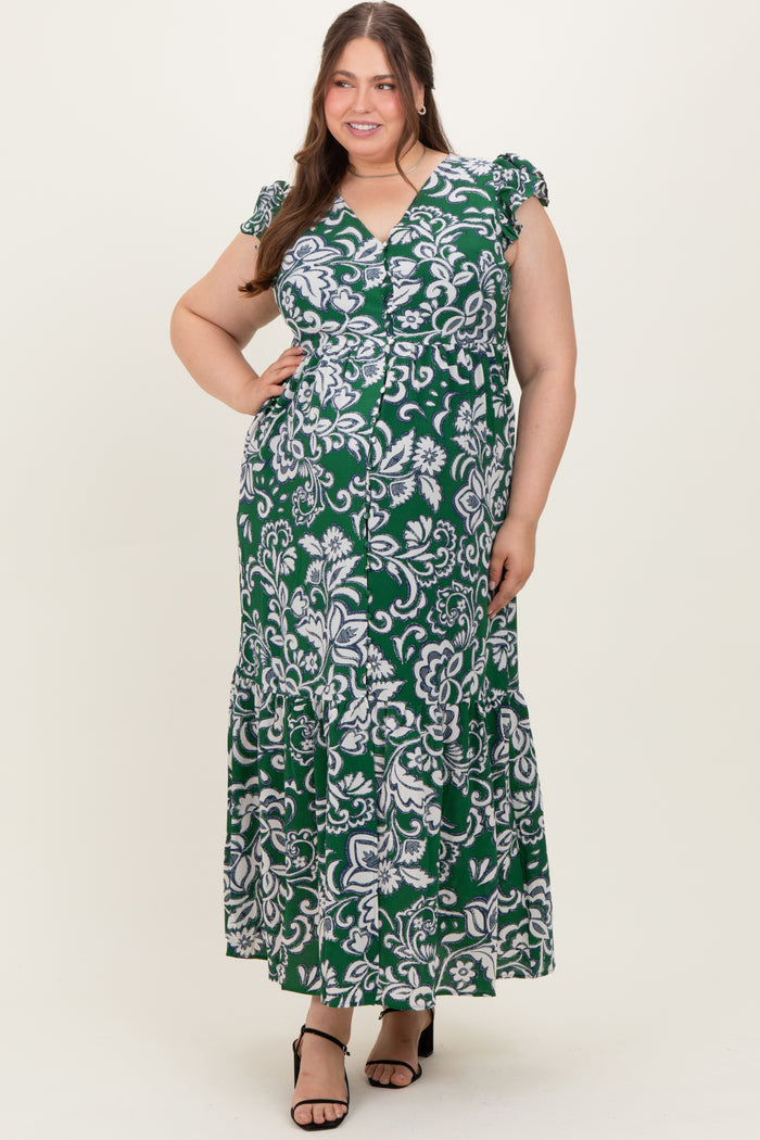 woman in a green and white floral patterned maternity dress with ruffled sleeves and a maxi length