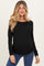 woman wearing a black long sleeve maternity top with ruching and showing her baby bump