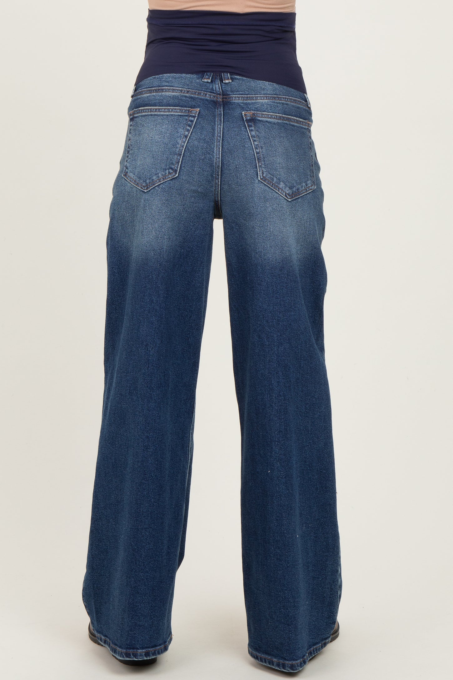 maternity wear dark wash wide leg jeans featuring a comfortable waistband at the top