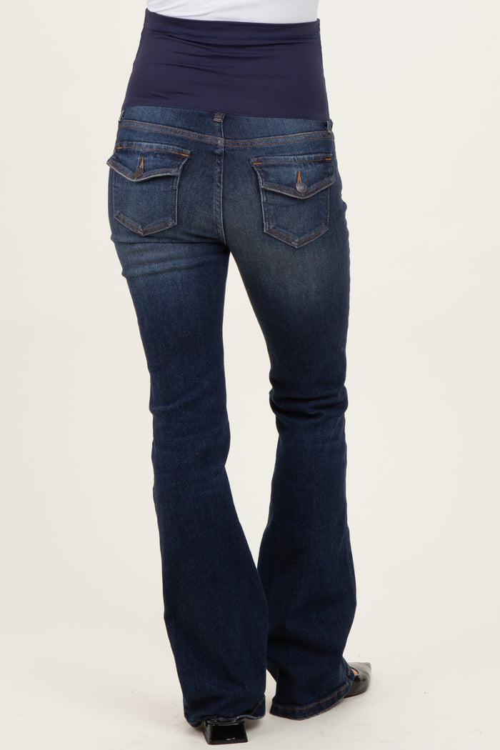 woman wearing dark blue maternity bootcut jeans with a navy underbelly panel, showing the back view