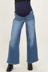 woman wearing light blue maternity wide-leg jeans with a dark blue belly panel