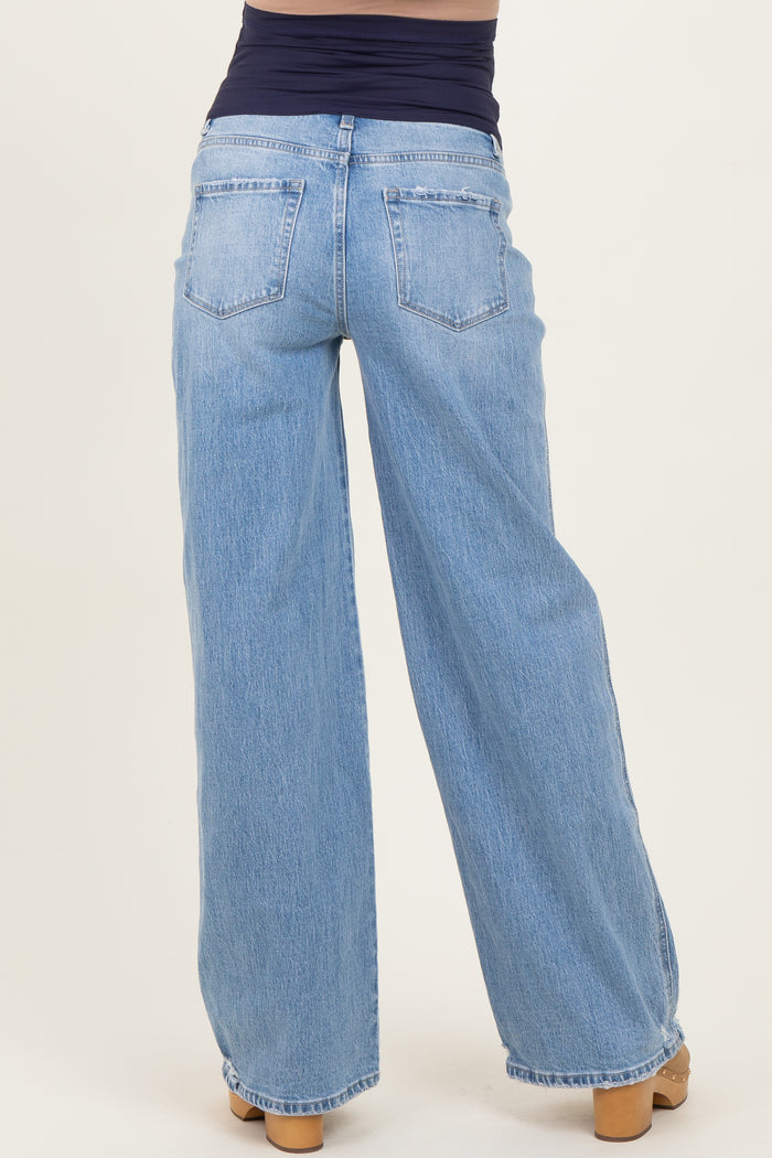 maternity wear wide leg light blue jeans being worn by a model, featuring a stretchy panel for comfort