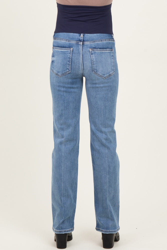 woman wearing a pair of light blue maternity jeans, showing the back view with a straight leg style and slight stretch