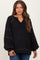 woman wearing a black maternity sweater with a v-neck and balloon sleeves, showing a relaxed fit