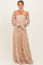 woman wearing a floral off-the-shoulder maxi dress with long sleeves and a fitted bodice