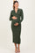 woman wearing a dark green ribbed maternity dress with a collar and button detail, holding her baby bump