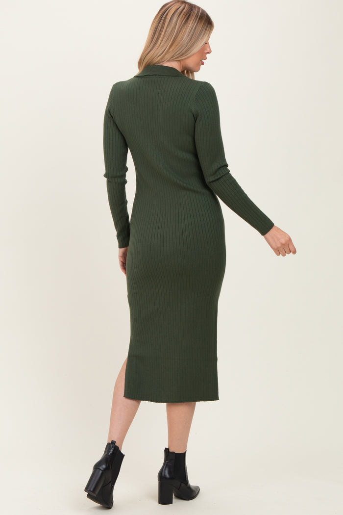 woman wearing a dark green ribbed midi dress with long sleeves and a fitted silhouette