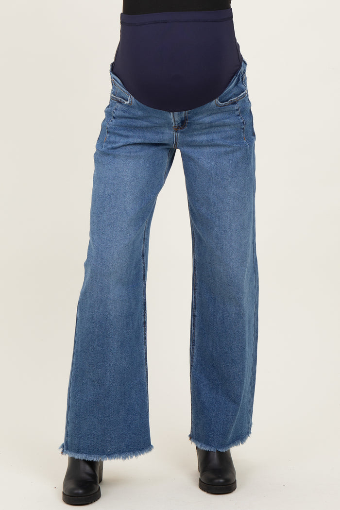 maternity wear blue wide leg jeans with a stretchy belly panel and frayed hem, worn by a model