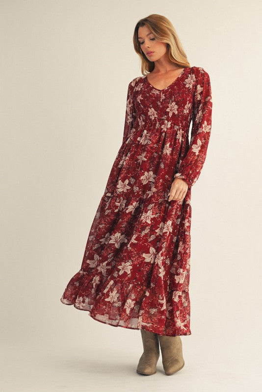 woman wearing a red floral long sleeve maxi dress and tan ankle boots