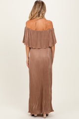 woman wearing a rose gold off-the-shoulder maternity dress with a pleated design and a flowing silhouette from the back