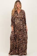 woman wearing a leopard print maternity maxi dress with a wrap style and a visible baby bump