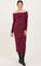 woman wearing a burgundy off-the-shoulder maternity dress with long sleeves and a fitted silhouette