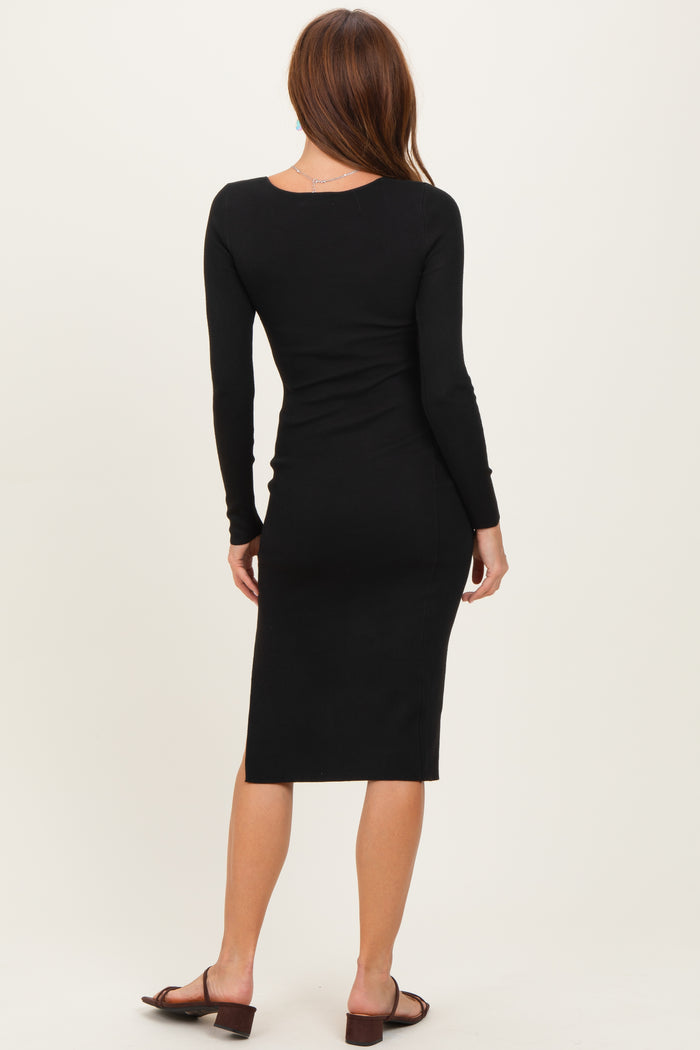 woman wearing a fitted black long sleeve midi dress with a scoop back and styled with brown heeled sandals