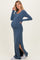 woman wearing a navy blue ribbed maternity maxi dress with side slits and showing her baby bump