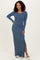 woman wearing a ribbed long sleeve maxi dress in blue with a side slit