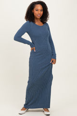 woman wearing a navy blue ribbed maxi dress with long sleeves and a scoop neckline