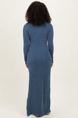 woman wearing a long sleeve ribbed maxi dress in blue, seen from the back